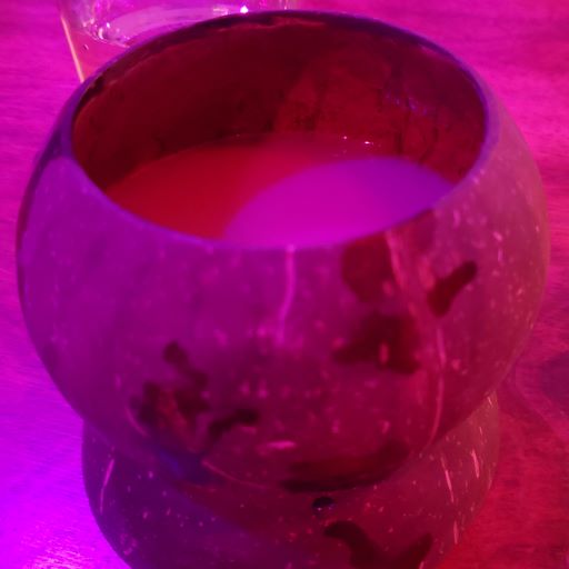 kava drink in a coconut shell cup